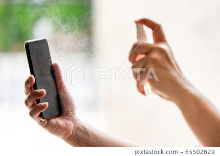 mobile phone cleaning using alcohol spray mobile phone cleaning using alcohol spray 65502629