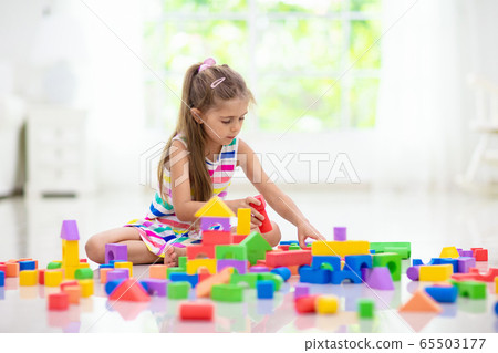 Child playing with toy blocks. Toys for kids. Child playing with toy blocks. Toys for kids. 65503177