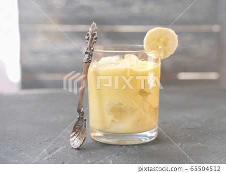 iced frothy banana smoothie. iced frothy banana smoothie. 65504512