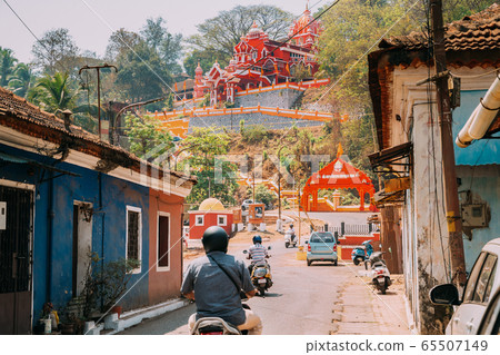 Panaji, Goa, India. Traffic on road to The Hindu Maruti Temple Or Hanuman Temple Is Located In Panjim. Built In Honor Of The God Of Monkeys Haruman. Famous Landmark And Heritage. Popular Destination 65507149