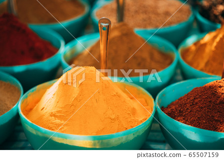Close View Of Masala Curry, Bright Colors Fragrant Seasoning, Condiment In Tray On Local Food Market, Bazaar Close View Of Masala Curry, Bright Colors Fragrant Seasoning, Condiment In Tray On Local Food Market, Bazaar 65507159