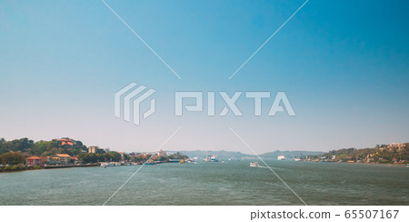 Panaji, Goa, India. Water Navigation On The Mandovi River. Ships Floating On River Panaji, Goa, India. Water Navigation On The Mandovi River. Ships Floating On River 65507167