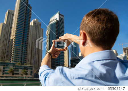 Male director chooses the best angle for shooting Male director chooses the best angle for shooting 65508247