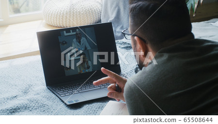 Man having video consultation with doctors 65508644