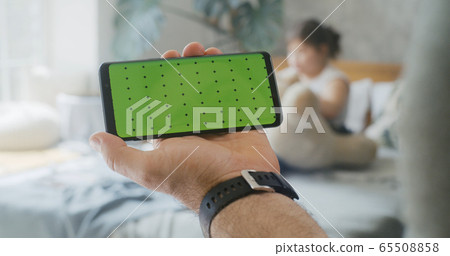 Man holding a smartphone 65508858