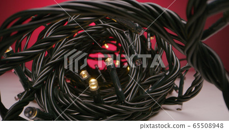 Fairy lights lying on tabletop Fairy lights lying on tabletop 65508948