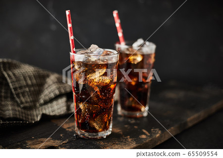 Close up glass of refreshing cola. Close up glass of refreshing cola. 65509554