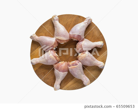 Isolated set of chicken thighs before cooking.  65509653