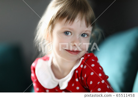 Happy child girl portrait against home 65511458