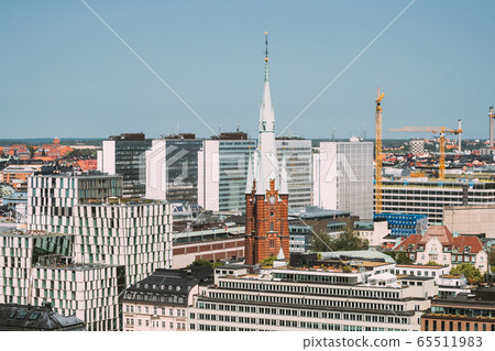 Stockholm, Sweden. Elevated View Of St. Clara Or Saint Klara Church In Summer Sunny Modern Cityscape Skyline Stockholm, Sweden. Elevated View Of St. Clara Or Saint Klara Church In Summer Sunny Modern Cityscape Skyline 65511983