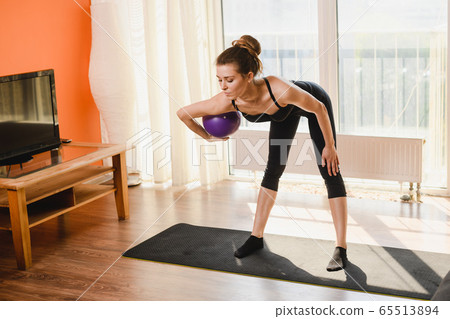 Sport woman training at home with ball Sport woman training at home with ball 65513894