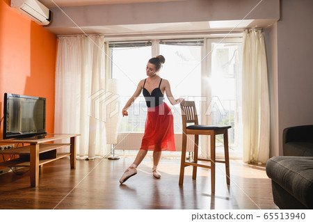 Beautiful ballerina girl dance at home isolation 65513940