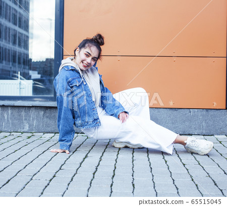 young pretty teenage girl posing cheerful happy smiling wearing street style outside in europe city, lifestyle people concept young pretty teenage girl posing cheerful happy smiling wearing street style outside in europe city, lifestyle people concept 65515045