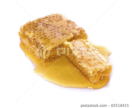 Honeycombs and sweet sticky honey puddle an Honeycombs and sweet sticky honey puddle an 65518415