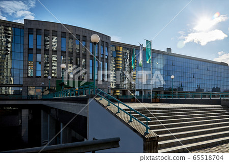 Banking center, business center in blur opposite a blue sky Banking center, business center in blur opposite a blue sky 65518704