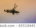 Flight of a military helicopter. 65519445