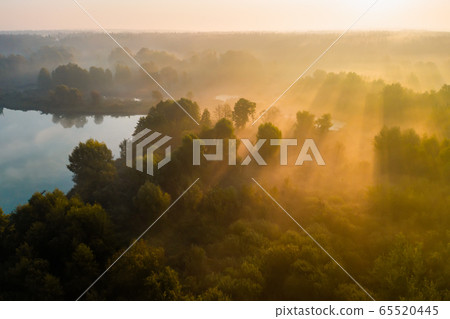 Beautiful misty dawn in the spring on the river. 65520445