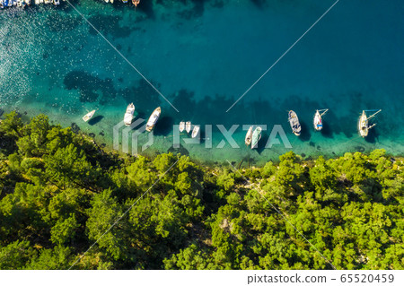Yachts in the bay near the green island. Summer vacation, Greece, Kefalonia. Yachts in the bay near the green island. Summer vacation, Greece, Kefalonia. 65520459