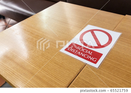 New normal with table signage prohibit occupancy to maintain social distance 65521759