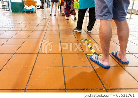 New normal social distancing with queue in line into supermarket in Malaysia 65521761