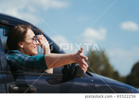Happy young woman traveling. Road car trip 65522256