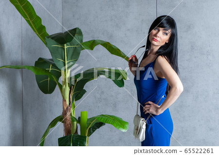Trendy beautiful, stylish girl in a blue dress, 65522261