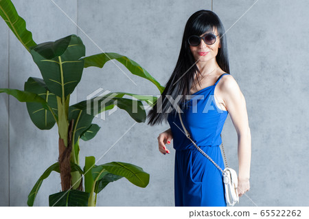 Expressive and glamorous beautiful girl in a blue Expressive and glamorous beautiful girl in a blue 65522262
