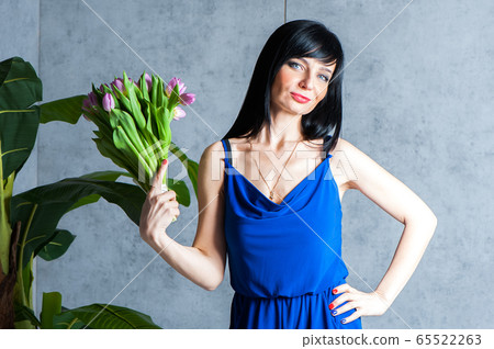 Expressive and glamorous beautiful girl in a blue Expressive and glamorous beautiful girl in a blue 65522263