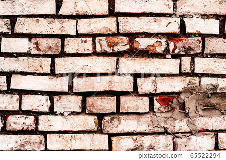 Texture of a brick wall with cracks Texture of a brick wall with cracks 65522294