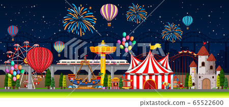 Themepark scene with many rides at night 65522600