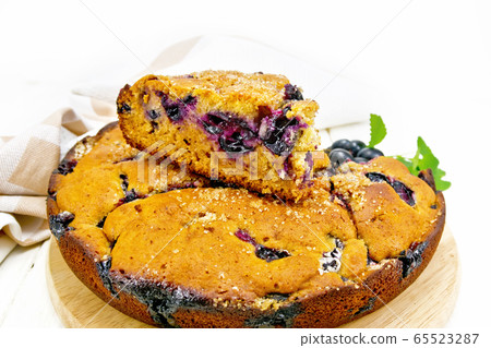 Pie with black grapes on wooden board Pie with black grapes on wooden board 65523287