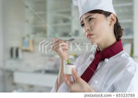 Worried female pastry chef Worried female pastry chef 65523789