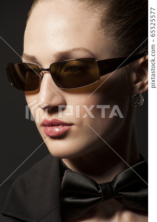 Portrait of Beautiful young woman in sunglasses Portrait of Beautiful young woman in sunglasses 65525577