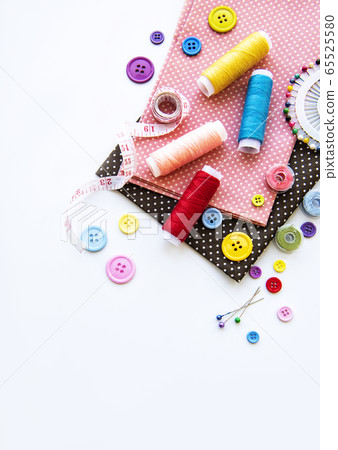 Sewing accessories on a white background Sewing accessories on a white background 65525580