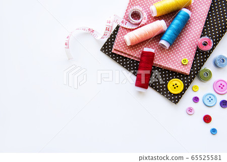 Sewing accessories on a white background Sewing accessories on a white background 65525581