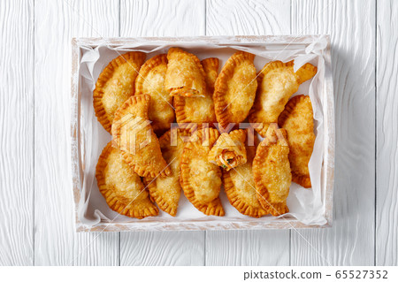 deep fried empanadas in a wooden box deep fried empanadas in a wooden box 65527352