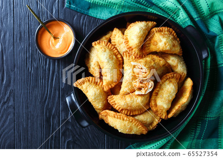 Buffalo Chicken Empanadas with dipping, flat lay 65527354