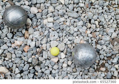 Petanque balls and the yellow wood jack Petanque balls and the yellow wood jack 65527360