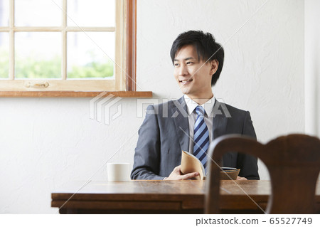 young man wearing a suit young man wearing a suit 65527749