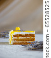 A piece of delicious cream cake. Tasty dessert. Over light wooden background. 65528525