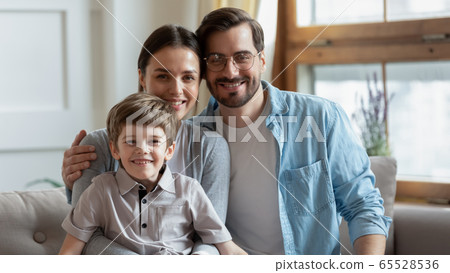 Portrait of happy family with little son at home 65528536