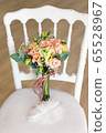 Wedding bouquet on white chair for weddings. 65528967
