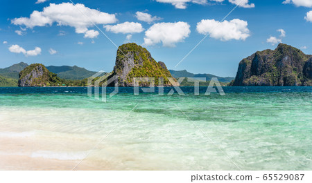 El Nido, Philippines. Panorama of limestone islands in El Nido Lagoon. Private Malapacao island in background 65529087