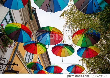 Street decorated with colored umbrellas. 65529325
