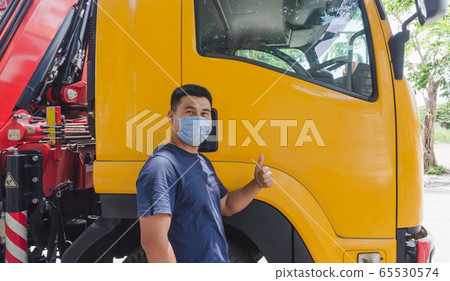 Truck drivers wearing medical masks Truck drivers wearing medical masks 65530574