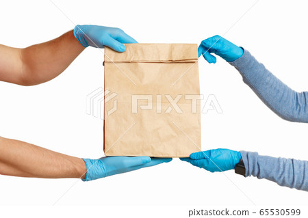 Courier in protective gloves giving parcel to client, cropped Courier in protective gloves giving parcel to client, cropped 65530599