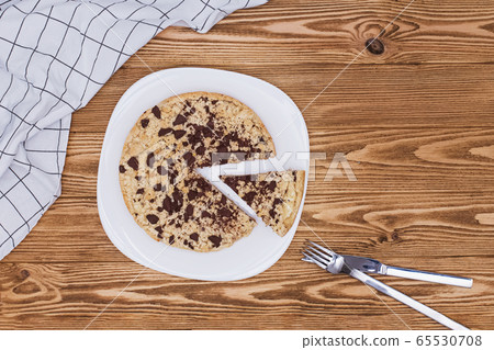 Homemade sweet cake with ricotta, crumbs and chocolate, Italian sbriciolata crumb pie on wooden table 65530708