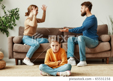 Annoyed parents arguing with each other in front Annoyed parents arguing with each other in front 65531158