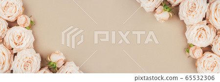 Spring background. Rose flowers on a beige background. 65532306