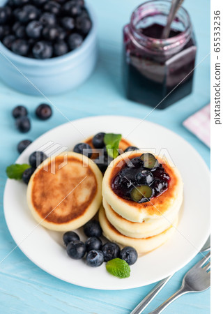 Cottage cheese fritters with blueberry jam Cottage cheese fritters with blueberry jam 65533236